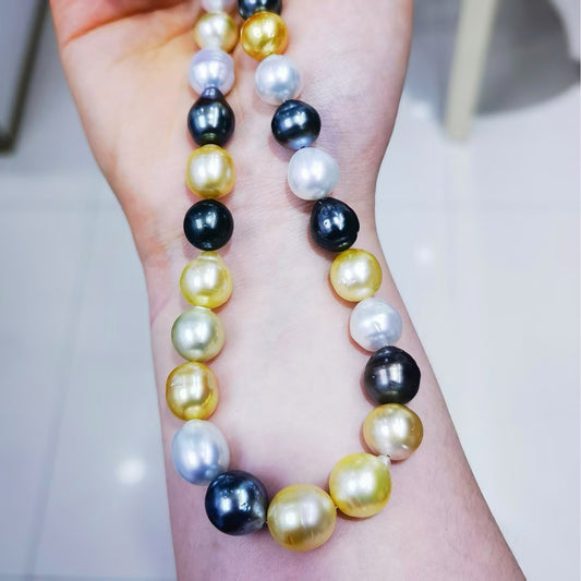 Finished mixed South Sea and Tahitian baroque pearl necklace shown on wrist for size and color detail