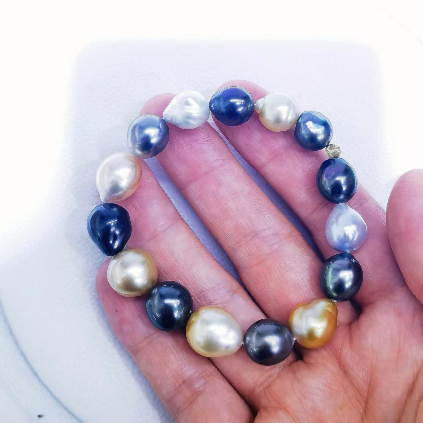 Mixed South Sea and Tahitian baroque pearl bracelet shown on hand for size and color detail
