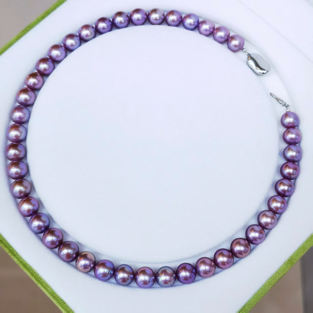 Full view of exact piece natural deep purple Edison freshwater pearl necklace