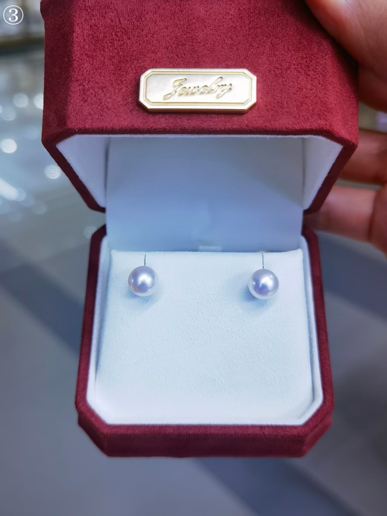 White Akoya saltwater cultured pearl stud earrings displayed in jewelry box