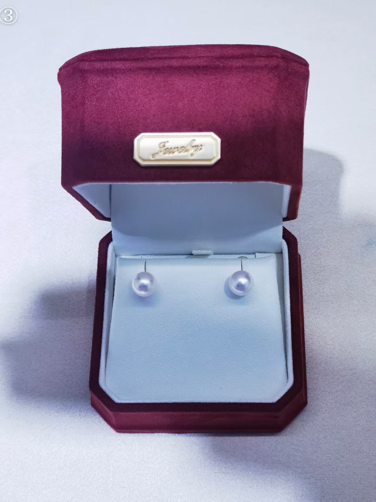 White Akoya pearl stud earrings in 18K gold setting, front view
