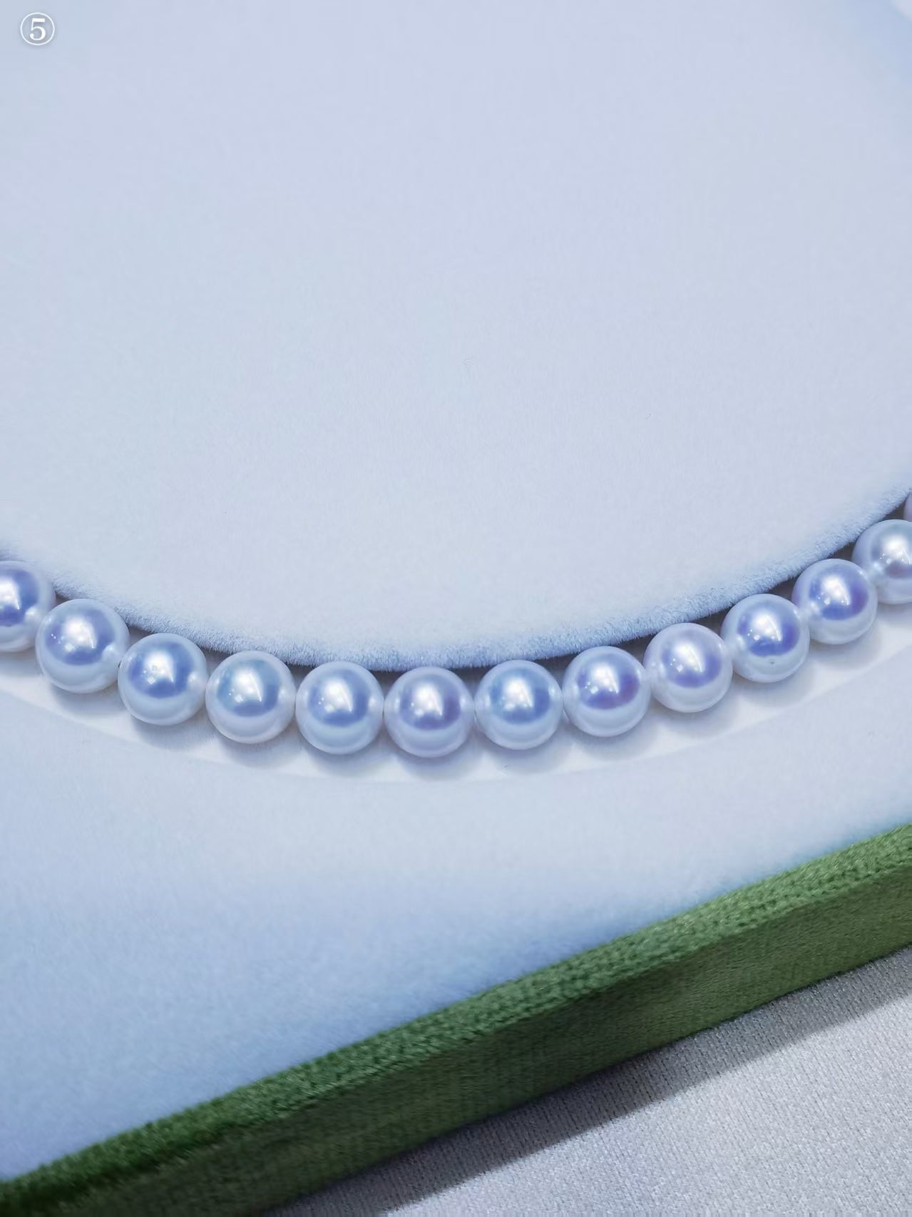 Close-up of white freshwater cultured pearls showing great luster and natural surface character