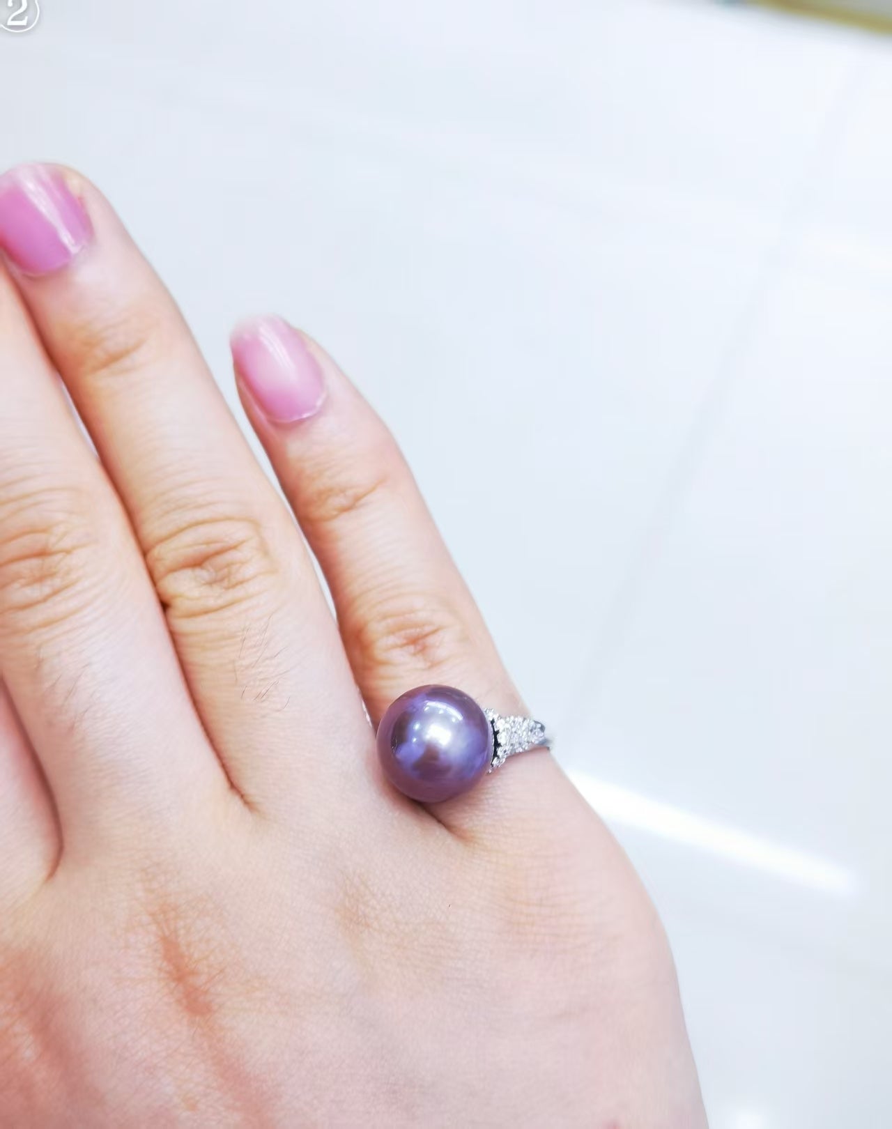 Large deep purple Edison freshwater pearl ring shown on hand for scale