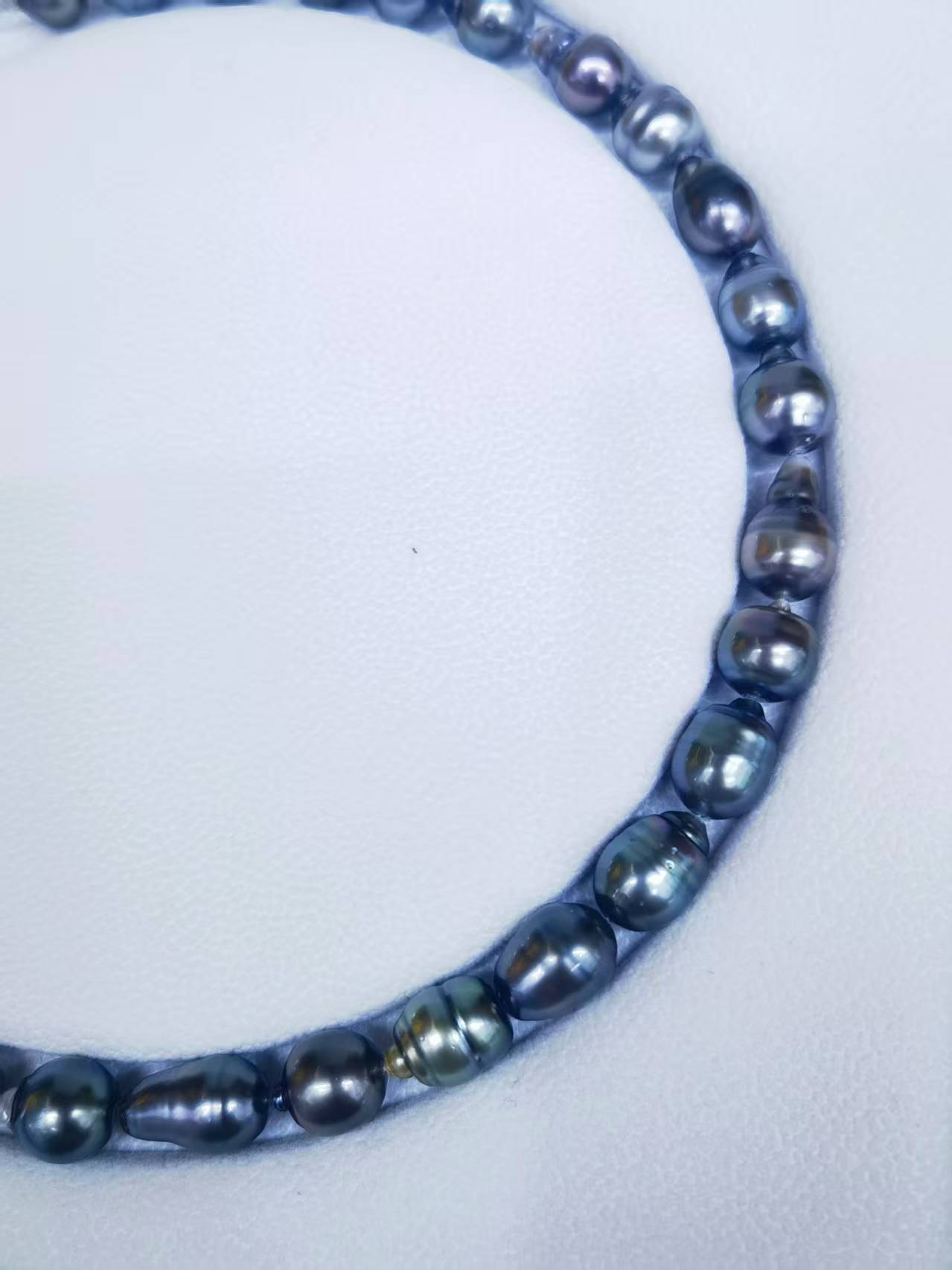 Close-up of graduated Tahitian baroque pearls with natural iridescence and surface character