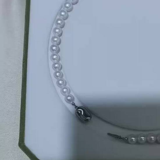Video of exact 7–10mm white freshwater pearl strand necklace showing luster, shape, and clasp