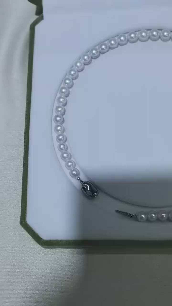 Video of exact 7–10mm white freshwater pearl strand necklace showing luster, shape, and clasp