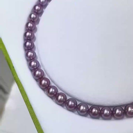Full view of exact piece natural deep purple Edison freshwater pearl necklace